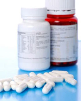 two bottles of medication with white pills