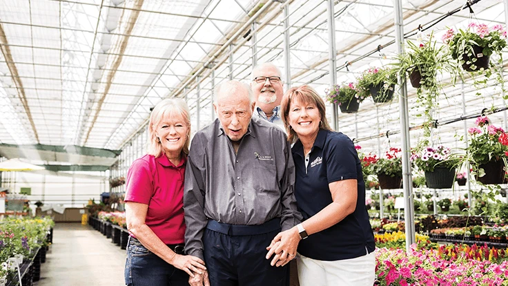 Norwin Heimos (center) with his children Mickey, Bernie and Amy